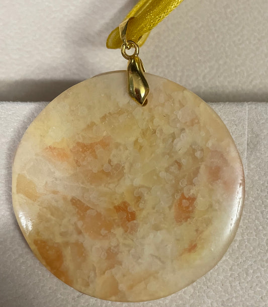 Gold and orange disc pendant